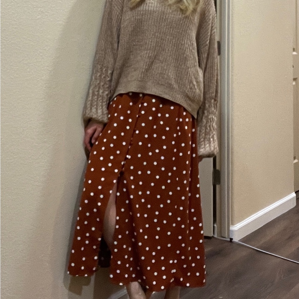Orange with white polka dot skirt